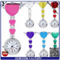 Yxl-957 Venta al por mayor Broche reloj de enfermera Cuatro hojas reloj médico de metal Color de sandía lindo forma de mariposa Precio de fábrica